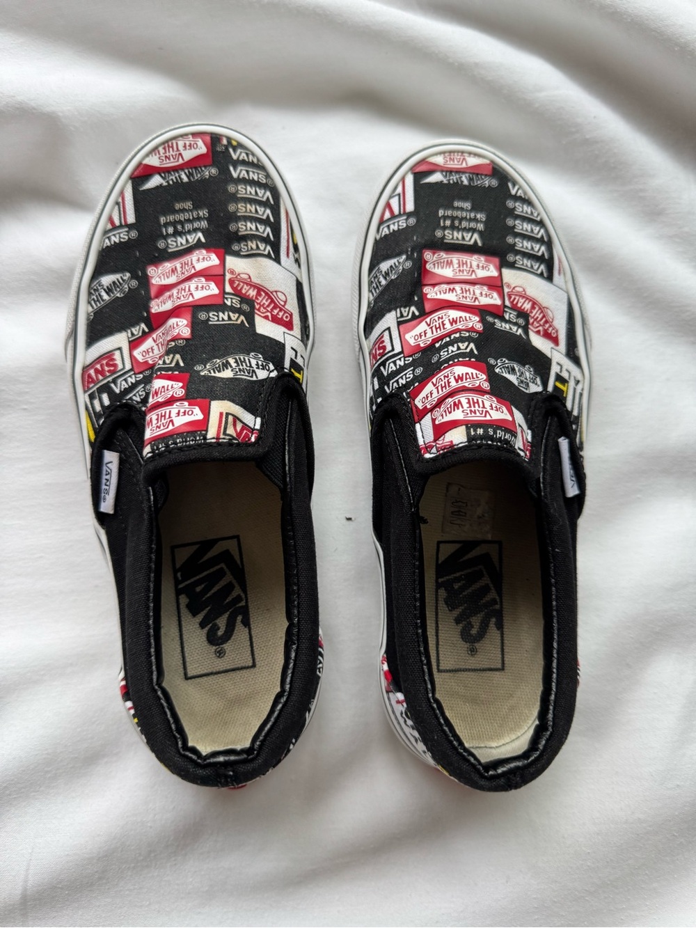 Vans Kids Slip-On Sneakers in Black, Red, White Logo Print